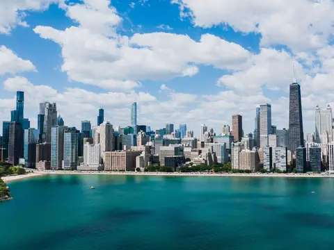 The Chicago skyline across the blue water of Lake Michigan